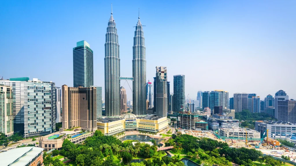 View of the Petronas Towers in Kuala Lumpur, Malaysia, lit up at night