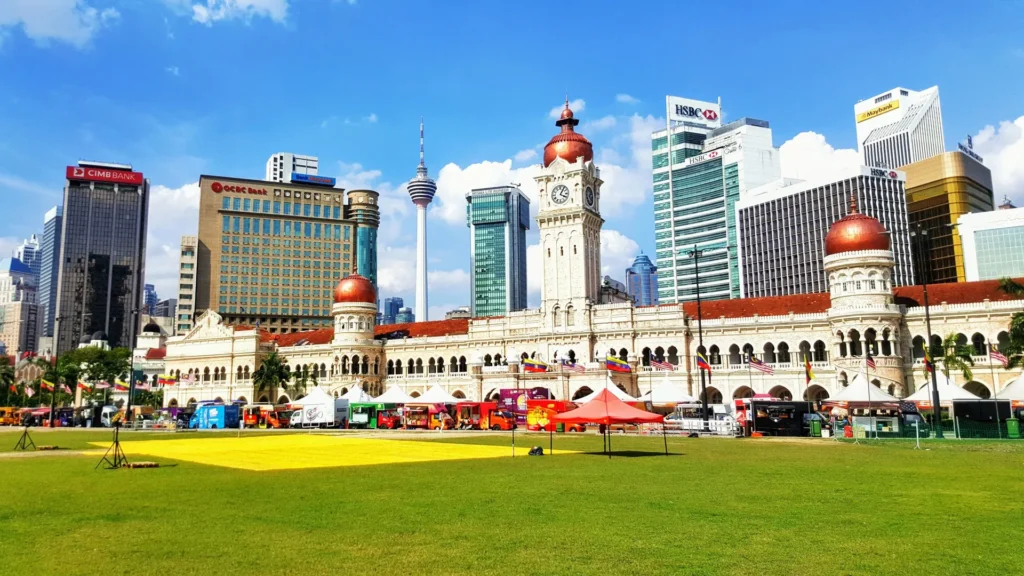 View of Merdeka Square in Kuala Lumpur, Malaysia, with historic buildings and the Malaysian flag
